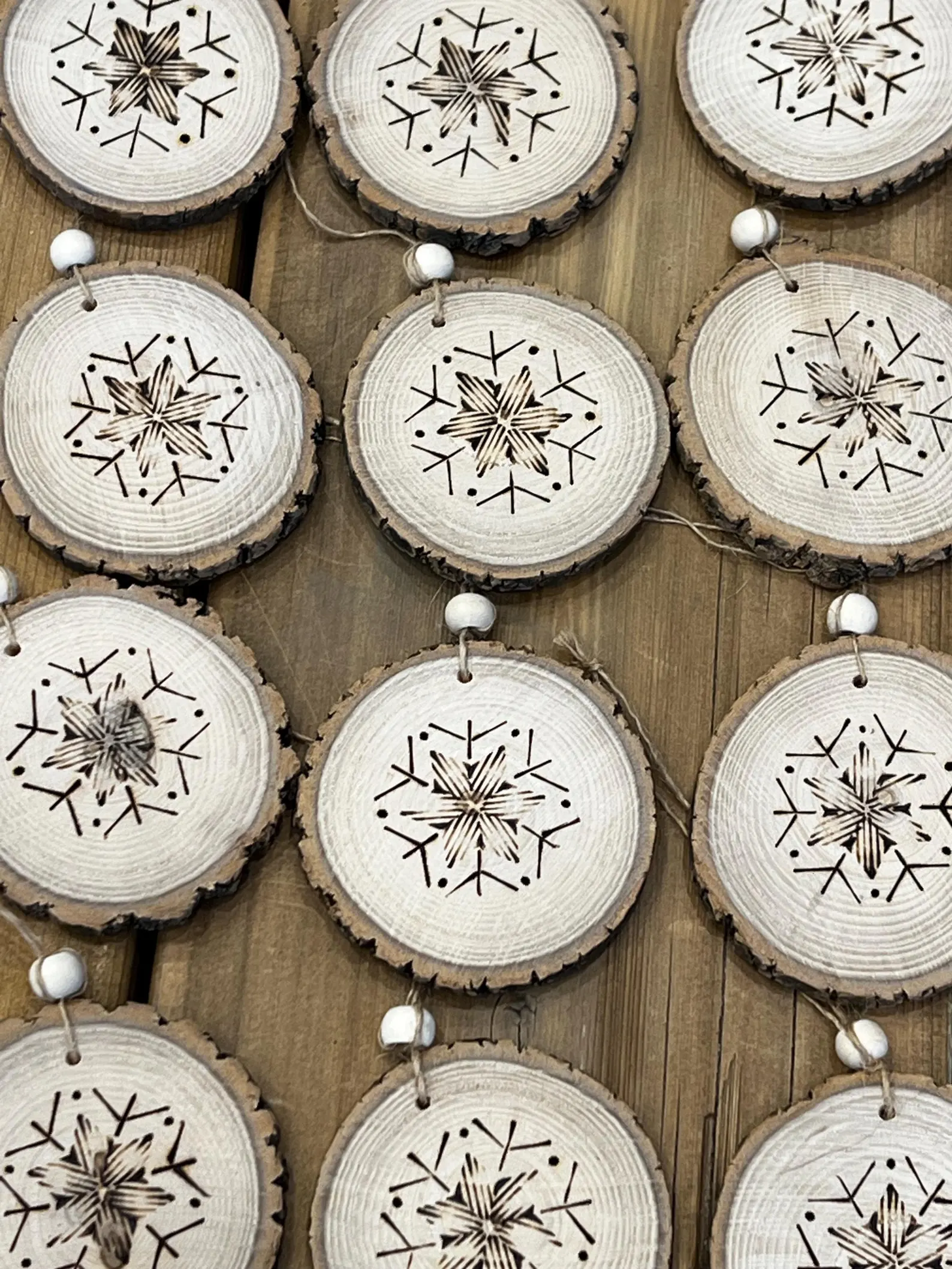 Handcrafted rustic wood burned ornament, 2.25 inches, perfect for holiday decorations. Handmade in Canada by Studio 27 Origins.